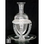 A late 19th Century Stourbridge clear crystal glass carafe of torpedo form with a medial collar to
