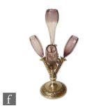 A late 19th century table centre epergne with silver plated base mounted with four graduated