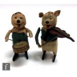 Two 1930s Schuco Disney's The Three Little Pigs clockwork pigs, comprising drumming pig and