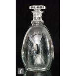 A 1930s Daum clear crystal decanter of ovoid form with a collar neck, rising to a flat stopper