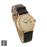 A gentleman's 9ct hallmarked quartz wrist watch, batons and date facility to a cream dial,