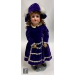 A Schoneau and Hoffmeister bisque socket head doll, head mould 914, with sleeping blue eyes with