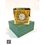 A late 20th Century square brass bedside clock with internal gimble movement by Sewills Liverpool,