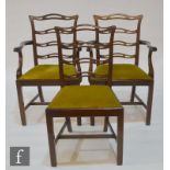 A set of seven early 20th Century mahogany dining chairs in the Georgian style, with pierced