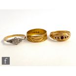 Three 18ct rings, a diamond cluster, a ruby and diamond five stone and a engraved wedding ring,