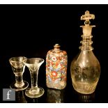 An early 19th Century pressed glass spirit decanter of Prussian form with basal moulding beneath