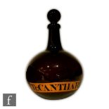 A 19th Century amethyst glass pharmaceutical bottle of compressed spherical form with collar neck,