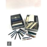 A collection of pens to include fountain and ballpoint examples and propelling pencils, to include a