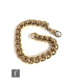 A 9ct hallmarked curb and patterned roller bracelet terminating in swivel clasp, length 23cm, weight