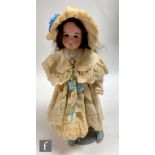 An AS Germany bisque socket head doll, with fixed brown eyes, open mouth with teeth, painted