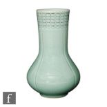 A Korean celadon glazed vase, the lobed form vase extending to a wide neck with incised floral