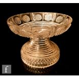 An early 19th Century pineapple stand, circa 1800, circular bowl above a tapering prism cut body,