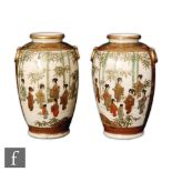 A pair of Japanese satsuma vases, Meiji (1868-1912) period, of rounded ovoid form, depicting a group