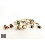 Four assorted stone set rings to include a 10ct emerald and diamond, a single stone pearl, weight