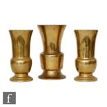 A set of three Chinese late Qing Dynasty (1644-1912) Gu beaker vases, each rising from a spreading