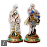 A pair of 19th Century French tinted bisque figures depicting a lady and gentleman in period dress