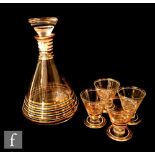 A 1930s Art Deco Czechoslovakian decanter of conical form decorated with white and gold gilding