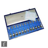 A cased set of twelve hallmarked silver tea spoons each with a sign of the Zodiac to the terminal,