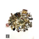 A parcel lot of assorted costume jewellery to include watches, brooches, beads, silver ring and