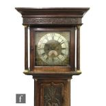 A 19th Century oak and mahogany cross-banded longcase clock with an eight-day movement striking on a