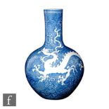 A Chinese late Qing Dynasty 'Dragon' bottle vase, Tianqiuping, the heavily potted vase incised and