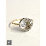 A 19th Century rock crystal single stone ring, claw set stone to a plain thin shank with cut
