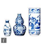 A collection of Chinese blue and white porcelain items to include a gourd vase with blossom
