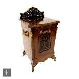 A late Victorian mahogany and parcel gilt purdonium, serpentine front with twin carrying sides, on