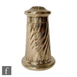A hallmarked silver caster of tapering wrythen form terminating in pierced button shaped cover,