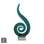 A later 20th Century Italian Murano glass sculptural form of scroll section in deep green mounted to