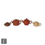 A collection of Chinese Yixing teapots, each of varying form, to include a bamboo trigram example, a