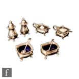 A hallmarked silver six piece, boat shaped cruet set, each raised on four pad feet, total weight