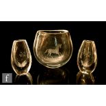 An Orrefors clear crystal glass vase of compressed ovoid form engraved with a prancing horse