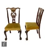 A set of six Chippendale style mahogany dining chairs, the pierced open splat below an undulating
