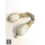 A 19th Century miser's purse in white and gilt bead inter-spaced form and two acorn shaped ends with