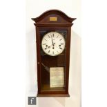 A late 20th century wall clock by Comitti London in a mahogany glazed case, height 60cm.