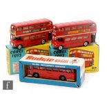 Three diecast model buses, a Corgi 468 London Transport Routemaster Bus with Outspan decals, a Corgi