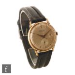 A mid 20th Century gentleman's 18ct Waltham wrist watch, gilt Arabic numerals, batons and date