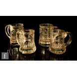 A pair of 19th Century glass tankards with slice cut and engraved decoration, height 12cm,