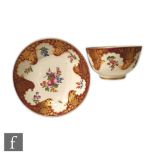 An 18th Century Worcester teabowl and saucer decorated in the Hope-Edwardes pattern, retains paper