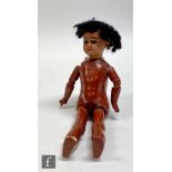 A Simon and Halbig bisque socket head black doll, with fixed brown eyes, open mouth with teeth,