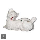 A mid 20th Century Italian model of a white Scottie type dog looking back to an applied insect on