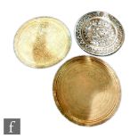 A collection of three Indian brass trays, one with silvered colouration, the further two with