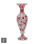 A 19th Century Bohemian glass vase, possibly Moser or Neuwelt of footed ovoid form with flared