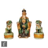 A group of Chinese 20th Century sancai style pottery figures modelled as a seated official wearing