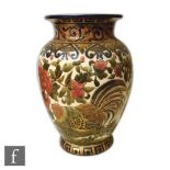 A large early 20th Century Zsolnay Pecs vase decorated with a cockerel amidst pink flowers and