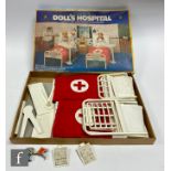 A 1970s Casdon Doll's Hospital, marketed as suitable for Sindy and Barbie, with two beds and