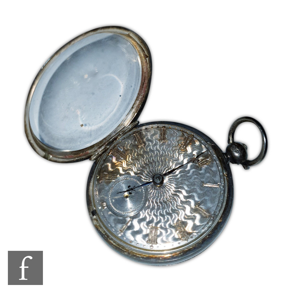 A hallmarked silver open faced, key wind, open faced pocket watch, gilt Roman numerals to a engine