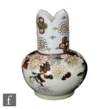 A Japanese early 20th Century vase, the rounded body rising to a rim with flower petal rim,