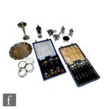 Assorted hallmarked silver items to include two cased sets of six tea spoons, one set with stone set